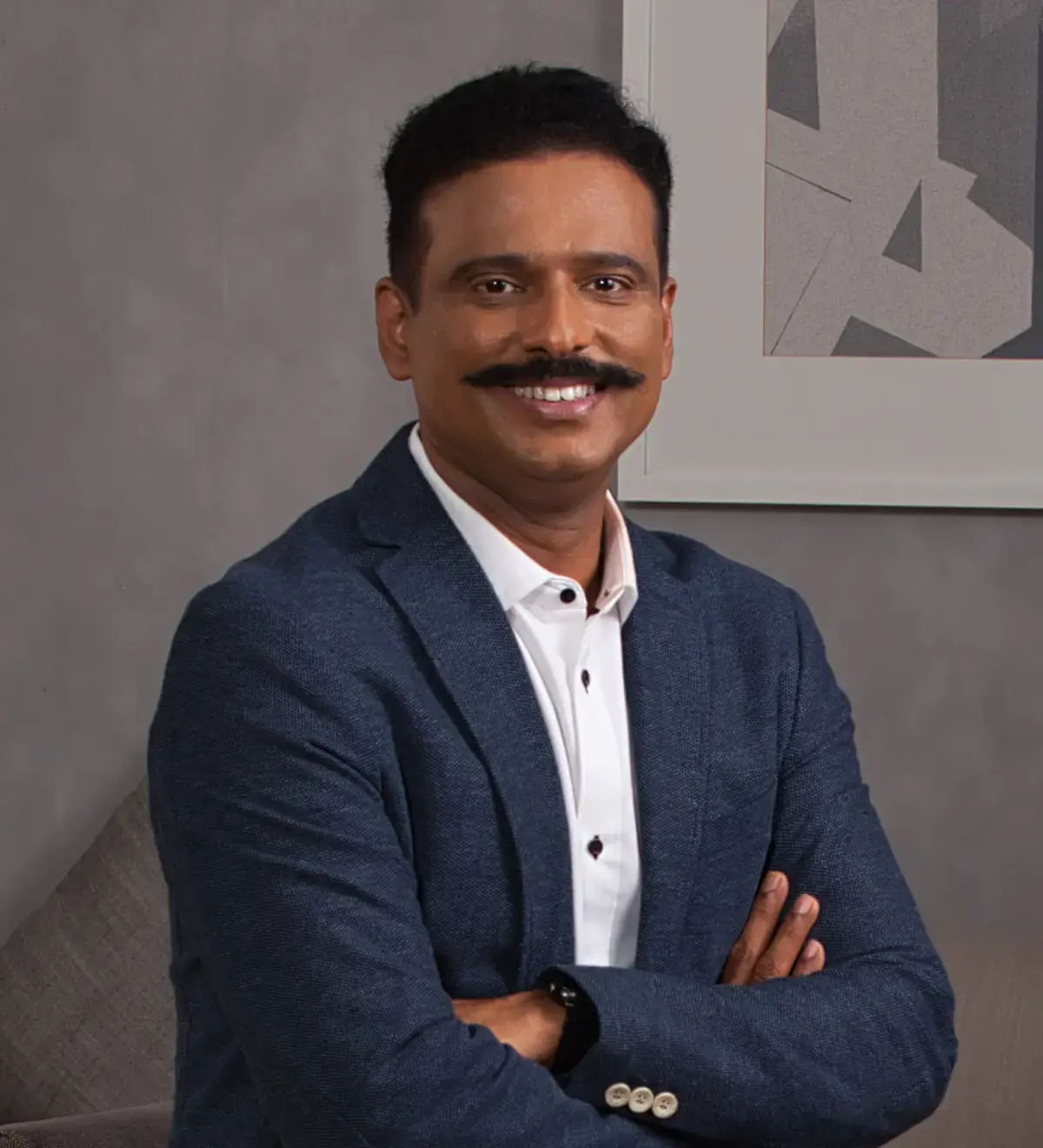 Portrait of Suresh the CEO of Kissflow, with a formal business attire and background